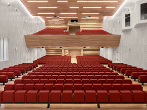 Interior view of the Congress Centre of Cordoba with red seating, designed by LAP architects in Spain, showcasing modern architectural design.